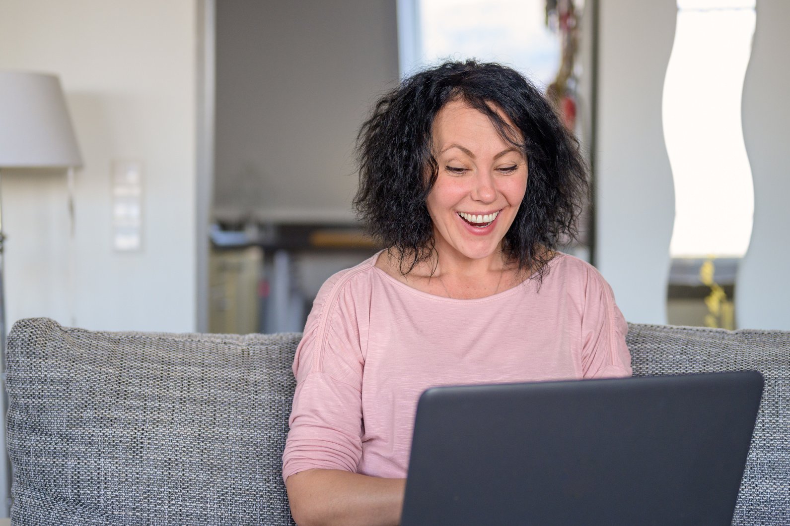 Happy woman working on her computer